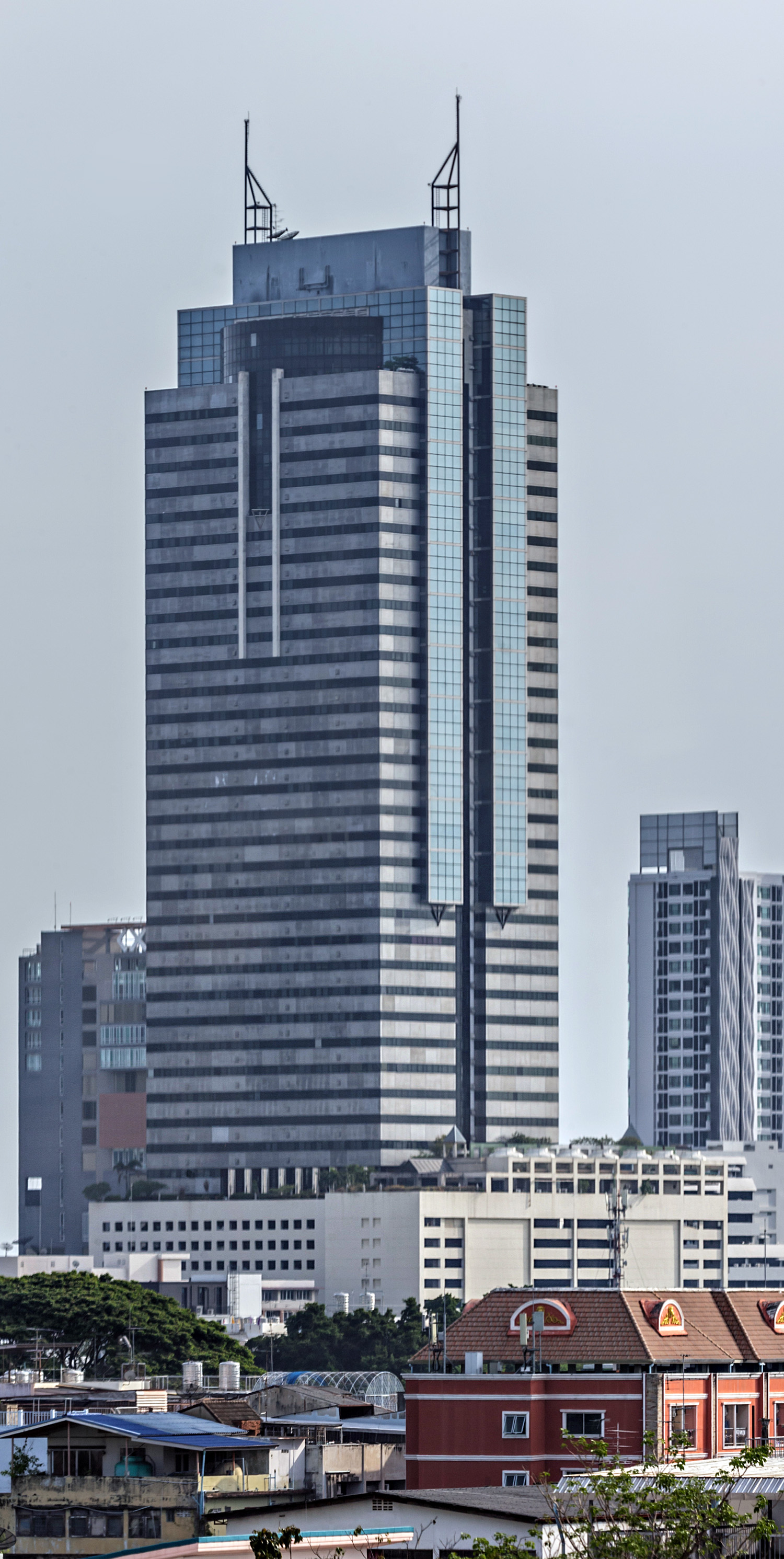 Sinn Sathorn Tower, Bangkok - Blurry photo through a monorail window. © Mathias Beinling
